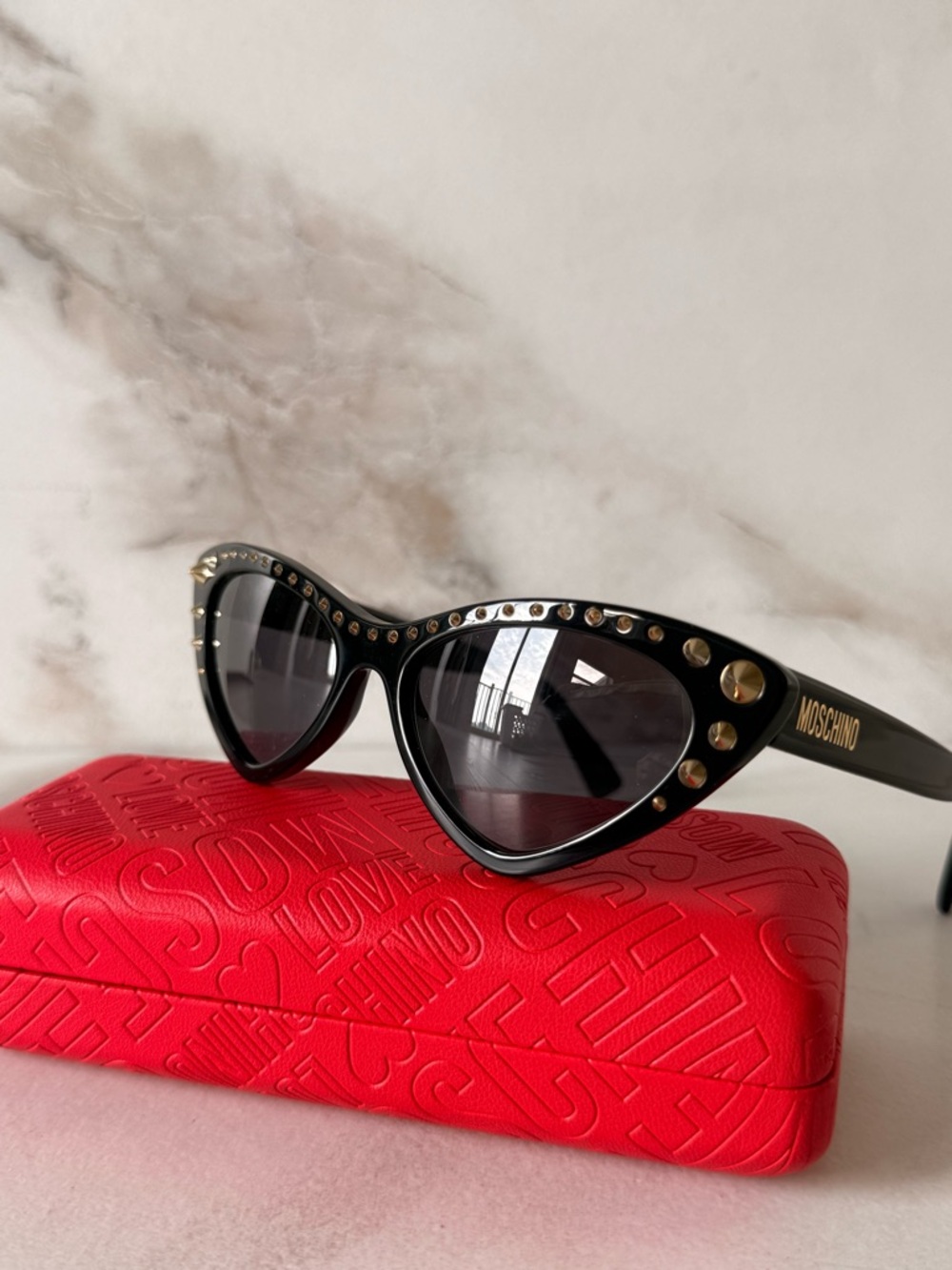 Moschino Black Cat-Eye Sunglasses with Gold Studs - Picture 2 of 9